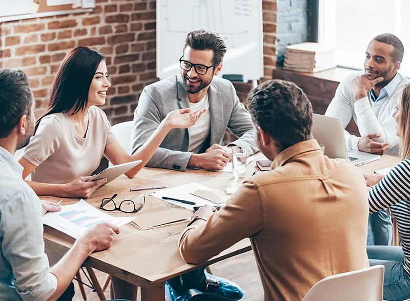 Business team collaborating around an office table