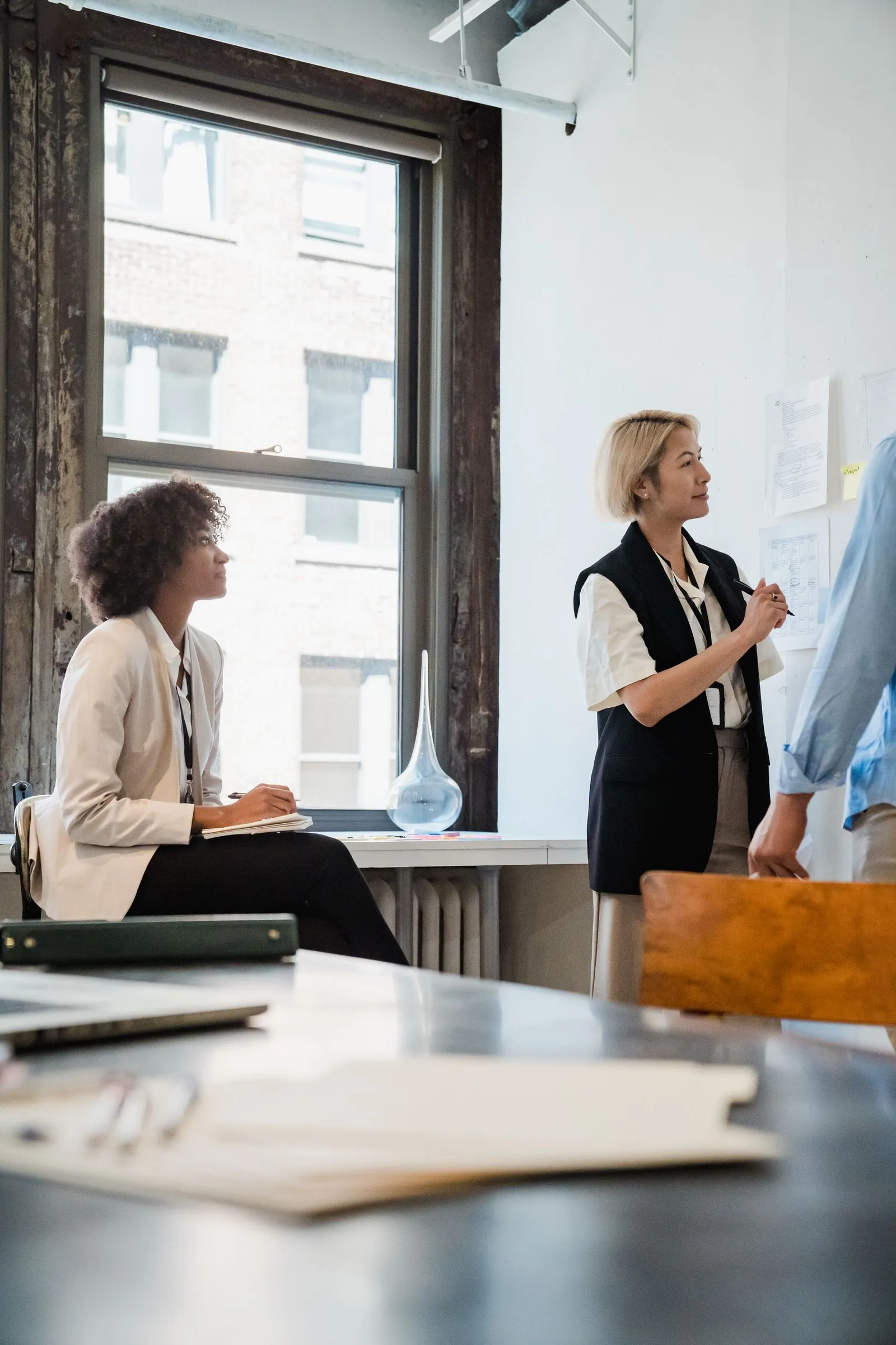Advisor walking a contact-center floor with the operations manager