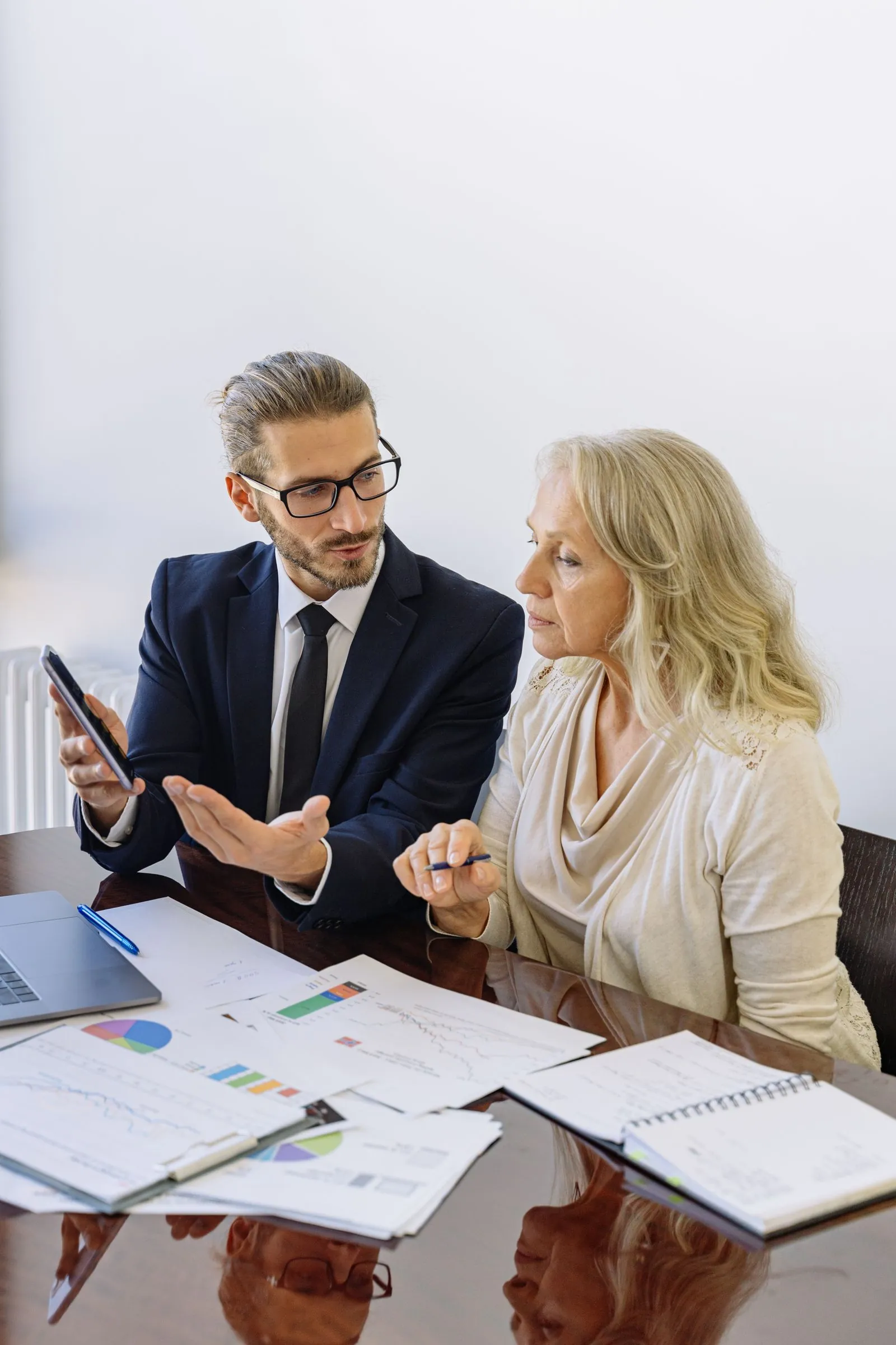 Banking service specialist reviewing account details on a screen