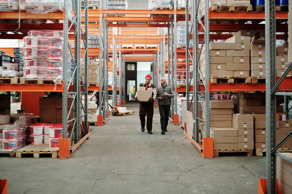 Retail customer-service agent packing an order in a warehouse workspace